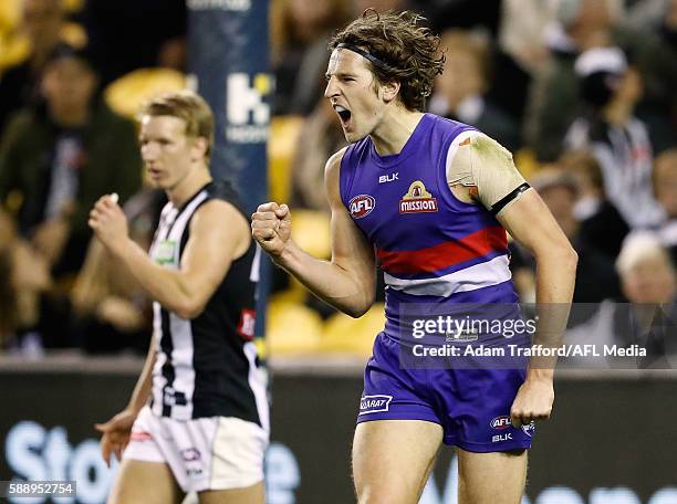 Marcus Bontempelli of the Bulldogs celebrates a goal during the 2016 AFL Round 21 match between the Western Bulldogs and the Collingwood Magpies at...