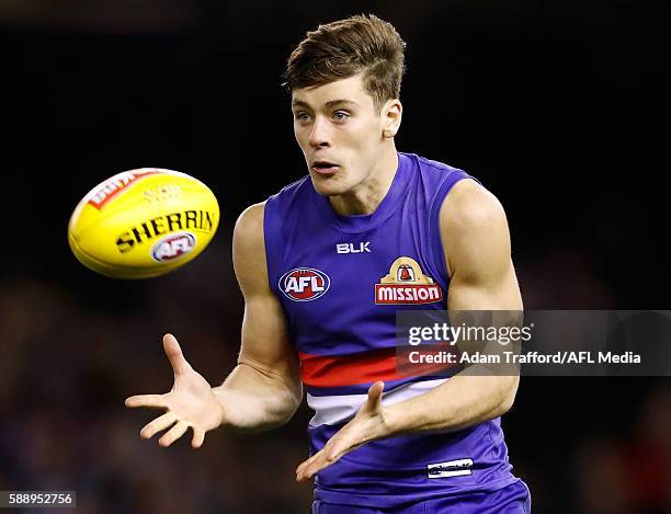 Josh Dunkley of the Bulldogs marks the ball during the 2016 AFL Round 21 match between the Western Bulldogs and the Collingwood Magpies at Etihad...