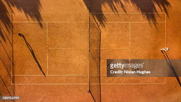 overhead shot of tennis players on tennis court - tennis net stock pictures, royalty-free photos & images