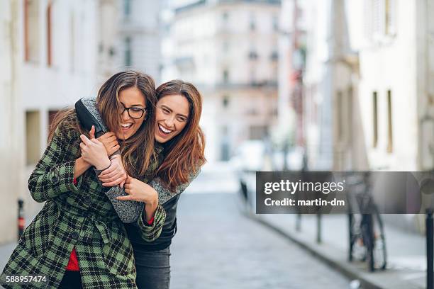 sisters enjoying paris - paris nice stock pictures, royalty-free photos & images