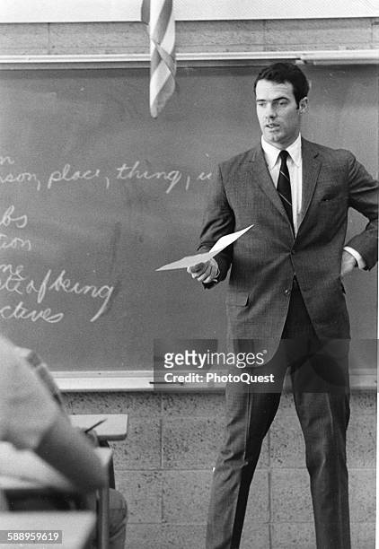 American teacher and decathlete Bill Toomey stands in front of a chalkboard, Santa Barbara, California, 1967.