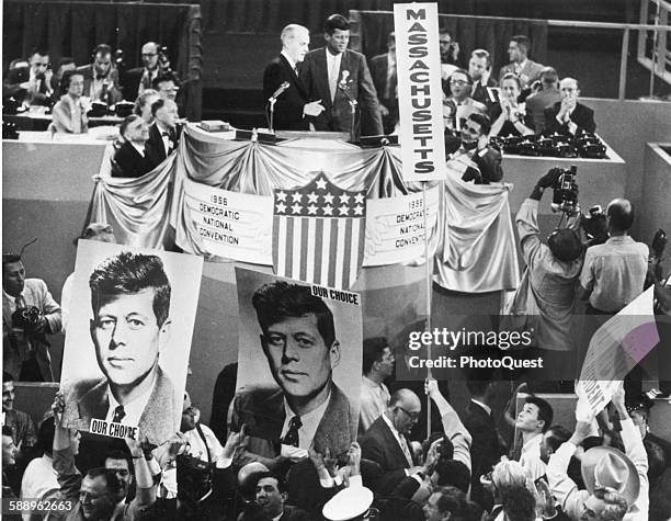 Politician John F Kennedy standing on the podium at the 1956 National Convention after his concession speech, Chicago, Illinois, August 1956.