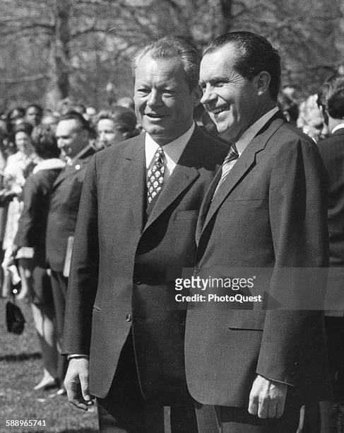West German Chancellor Willy Brandt and President Richard M Nixon stand during arrival ceremonies at the White House, Washington DC, April 10, 1970.