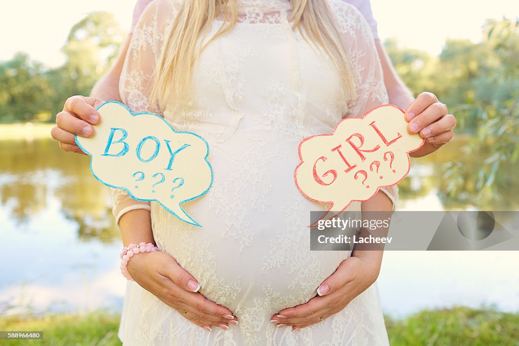 Pregnant couple choosing gender of the baby,  child's name.