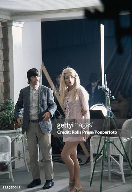 English musician, actor and drummer with The Beatles, Ringo Starr pictured with Swedish actress Ewa Aulin on the set of the film 'Candy' in 1968.