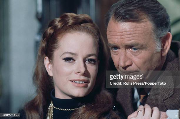 Italian actress Luciana Paluzzi pictured with English actor John Mills in a scene from the film 'A Black Veil for Lisa' in Italy in March 1968.