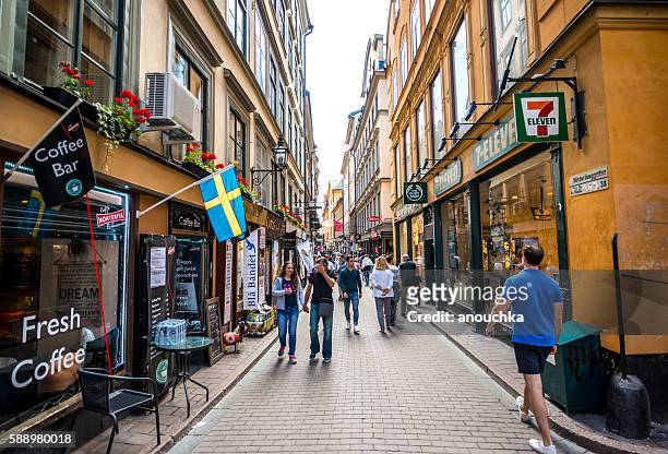 crowds of tourists exploring gamla stan, stockholm, sweden - stockholm stock pictures, royalty-free photos & images