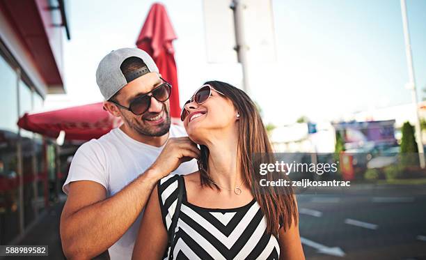 man giving his wife a necklace as gift - jewellery gift stock pictures, royalty-free photos & images