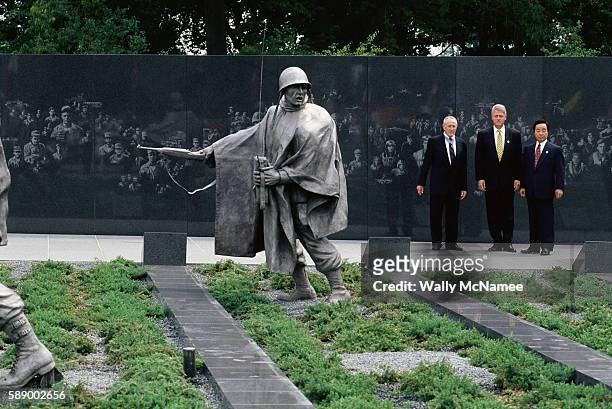 General Raymond Davis, President Clinton, and South Korean President Kim Young Sam stand alongside the Korean War Veterans Memorial during the 1995...