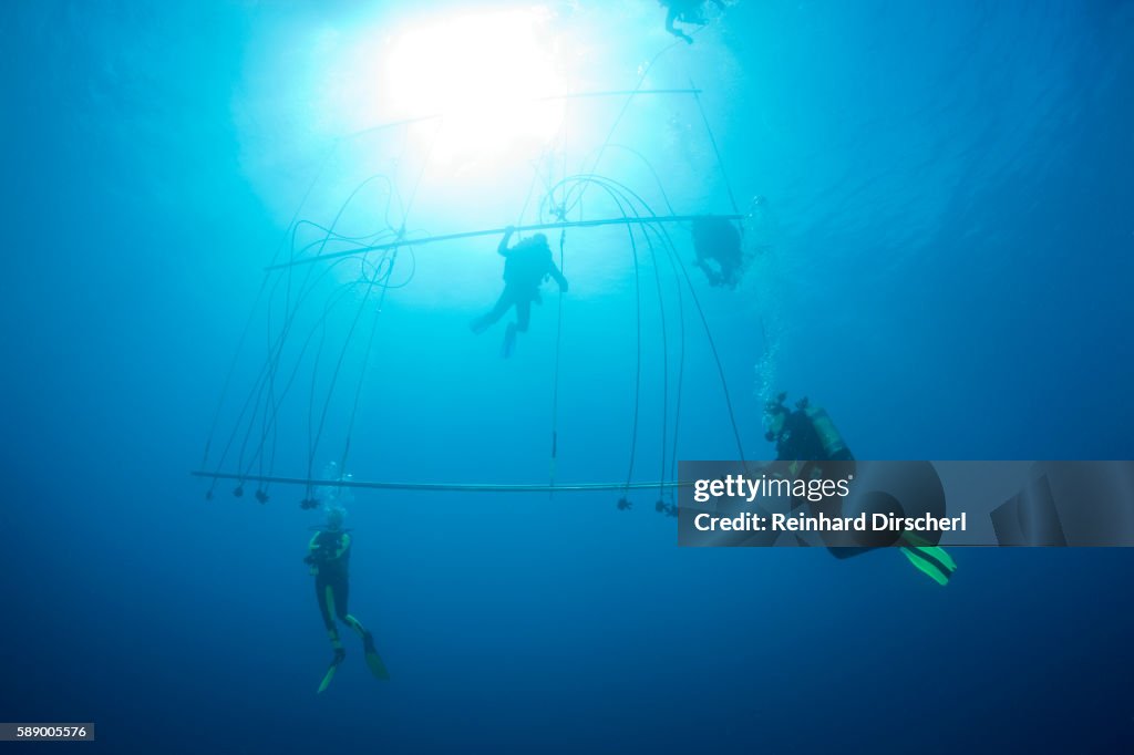 Floating Decompression Divers Decompress With Oxygen After A Deep Dive To A Shipwreck At A ...