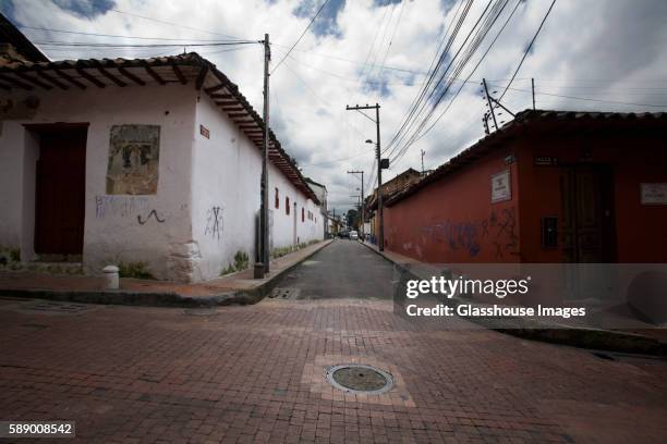 intersection of roads in poor neighborhood, bogota, colombia - colombia street stock pictures, royalty-free photos & images