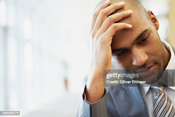 businessman with hand on head - oliver eltinger stock pictures, royalty-free photos & images