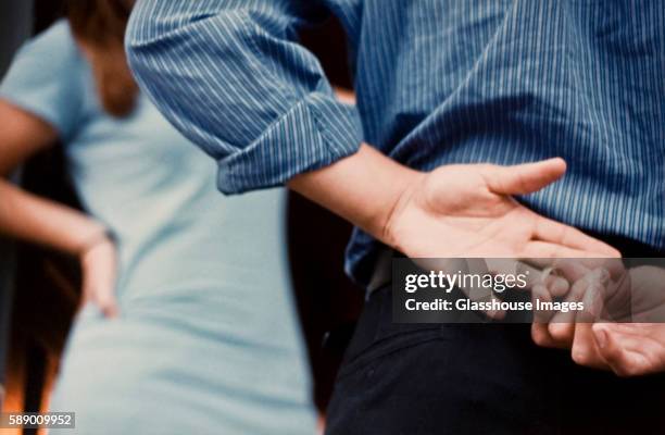 man removing wedding ring - affair foto e immagini stock