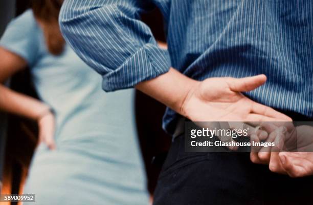 man removing wedding ring - cheating ストックフォトと画像