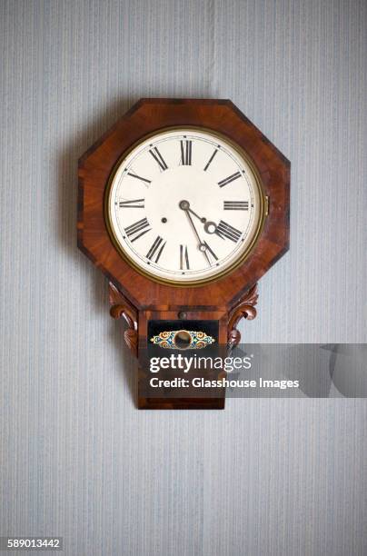 antique wall clock - wanduhr stock-fotos und bilder