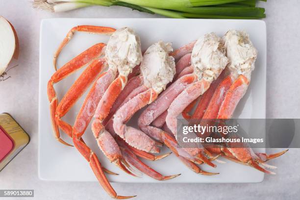 frozen king crab legs on platter - animal leg stock pictures, royalty-free photos & images