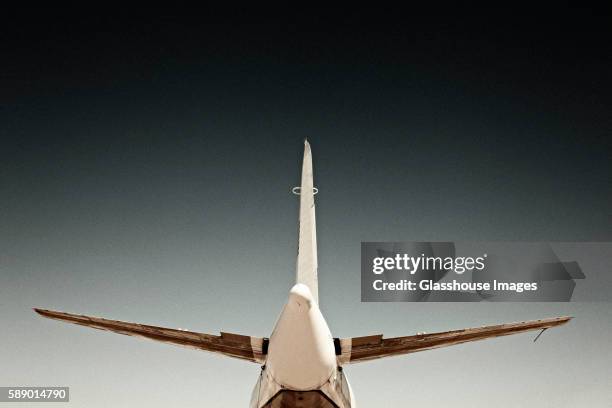 airplane wings and tail, rear view - airplane tail wing stock pictures, royalty-free photos & images