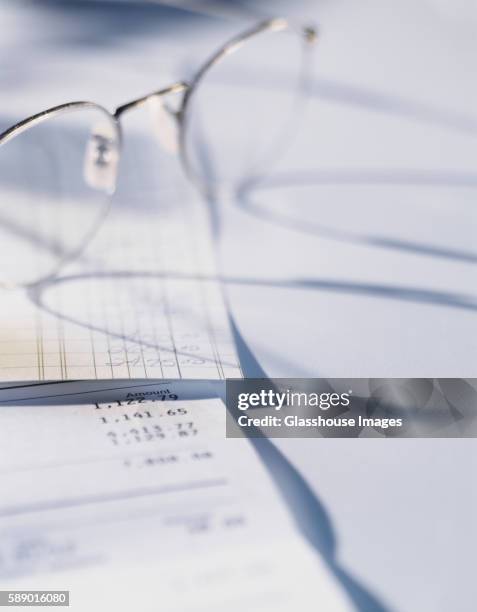 ledger with eyeglasses - accounting ledger stock pictures, royalty-free photos & images