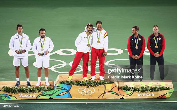 Silver medalists Horia Tecau and Florin Mergea of Romania, gold medalists Rafael Nadal and Marc Lopez of Spain, and bronze medalists Steve Johnson...