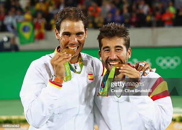 Gold medalists Rafael Nadal and Marc Lopez of Spain celebrate with their medals after the Men's Doubles Gold medal match against Horia Tecau and...
