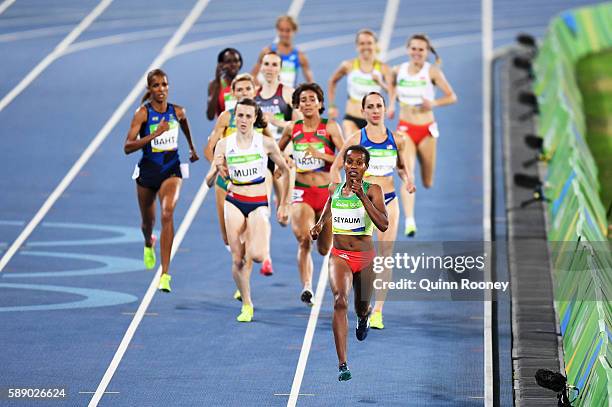 Dawit Seyaum of Ethiopia and Laura Muir of Great Britain compete in round one of the Women's 1500 metres on Day 7 of the Rio 2016 Olympic Games at...