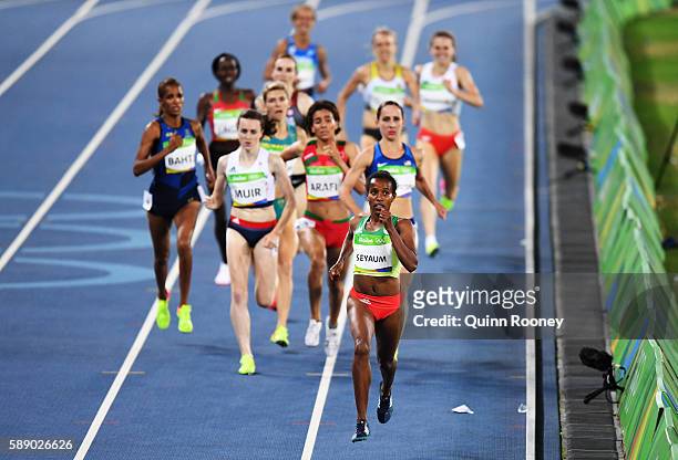 Dawit Seyaum of Ethiopia and Laura Muir of Great Britain compete in round one of the Women's 1500 metres on Day 7 of the Rio 2016 Olympic Games at...