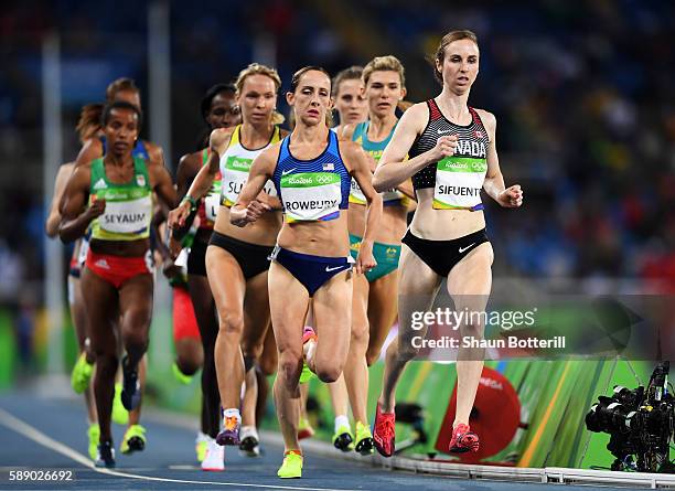 Shannon Rowbury of the United States and Nicole Sifuentes of Canada compete in round one of the Women's 1500 metres on Day 7 of the Rio 2016 Olympic...