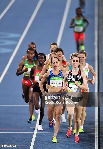 Shannon Rowbury of the United States and Nicole Sifuentes of Canada compete in round one of the Women's 1500 metres on Day 7 of the Rio 2016 Olympic...