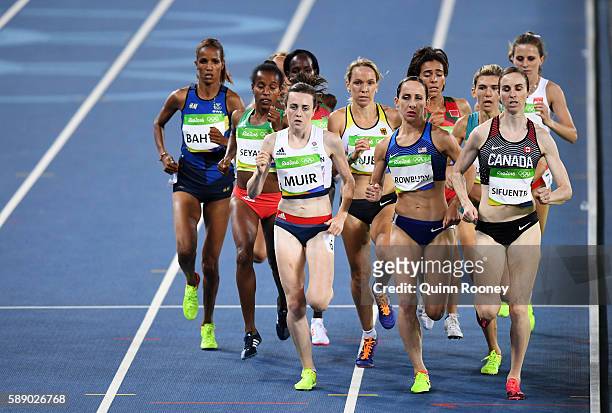 Laura Muir of Great Britain, Shannon Rowbury of the United States and Nicole Sifuentes of Canada compete in round one of the Women's 1500 metres on...