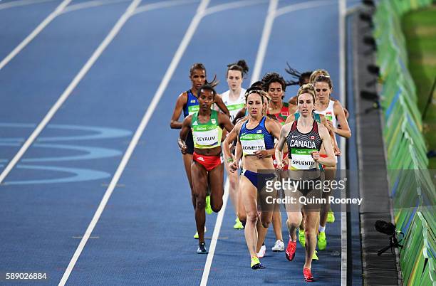 Shannon Rowbury of the United States and Nicole Sifuentes of Canada compete in round one of the Women's 1500 metres on Day 7 of the Rio 2016 Olympic...