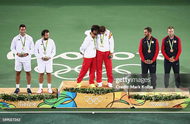 Silver medalists Horia Tecau and Florin Mergea of Romania, gold medalists Rafael Nadal and Marc Lopez of Spain, and bronze medalists Steve Johnson...