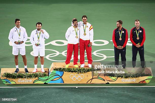 Silver medalists Horia Tecau and Florin Mergea of Romania, gold medalists Rafael Nadal and Marc Lopez of Spain, and bronze medalists Steve Johnson...