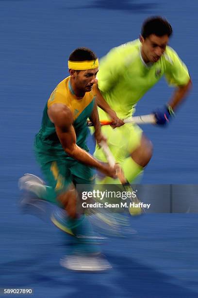 Jamie Dwyer of Australia runs upfield with the ball against Brazil during a Men's Preliminary Pool B match on Day 7 of the Rio 2016 Olympic Games at...