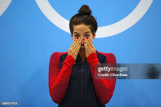 Gold medalist Madeline Dirado of the United States celebrates on the podium during the medal ceremony for the Women's 200m Backstroke Final on Day 7...
