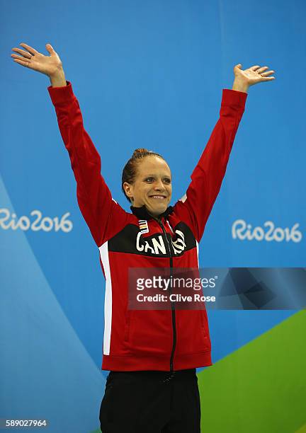 Bronze medalist Hilary Caldwell of Canada celebrates on the podium during the medal ceremony for the Women's 200m Backstroke Final on Day 7 of the...