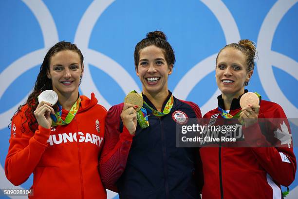 Silver medalist Katinka Hosszu of Hungary, gold medalist Madeline Dirado of the United States and bronze medalist Hilary Caldwell of Canada pose on...
