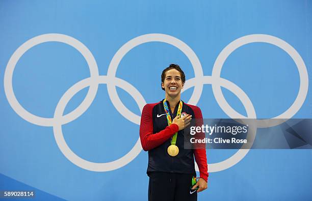 Gold medalist Madeline Dirado of the United States celebrates on the podium during the medal ceremony for the Women's 200m Backstroke Final on Day 7...