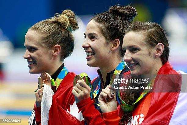 Bronze medalist Hilary Caldwell of Canada, gold medalist Madeline Dirado of the United States and Silver medalist Katinka Hosszu of Hungary pose...