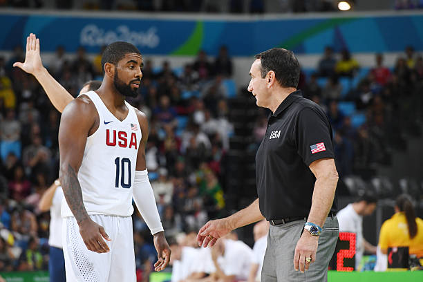 Kyrie Irving and head coach Mike Krzyzewski of the USA Basketball Men's National Team talk during the game against Serbia on Day 7 of the Rio 2016...