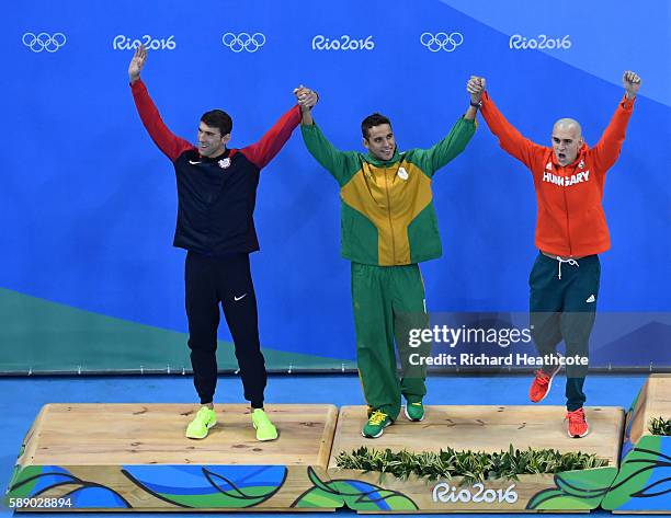 Joint silver medalists, Michael Phelps of United States, Chad Guy Bertrand le Clos of South Africa and Laszlo Cseh of Hungary celebrate winning...