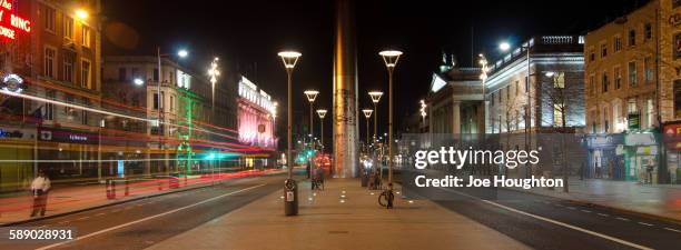 the spire and o'connell street by night - spire stock pictures, royalty-free photos & images