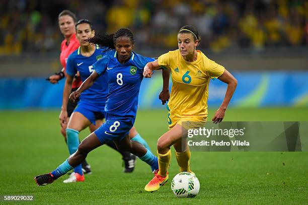 DBELO HORIZONTE, BRAZIL Chloe Logarzo of Australia dribbles against Formiga of Brazil in the first half during the Women's Football Quarterfinal...
