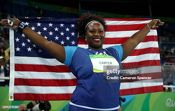 Michelle Carter of the United States celebrates placing first in the Women's Shot Put Final on Day 7 of the Rio 2016 Olympic Games at the Olympic...