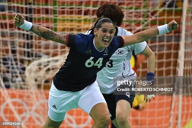 France's right back Alexandra Lacrabere celebrates a goal during the women's preliminaries Group B handball match South Korea vs France for the Rio...