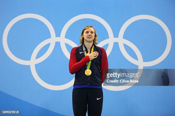 Katie Ledecky of United States celebrates on the podium after winning gold in the Women's 800m Freestyle Final on Day 7 of the Rio 2016 Olympic Games...