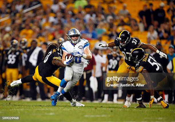 Jace Billingsley of the Detroit Lions catches a 27 yard touchdown pass in the fourth quarter against Steven Johnson, Jordan Dangerfield and Ricardo...