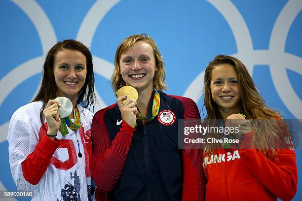 Sivler medalist Jazz Carlin of Great Britain, gold medalist Katie Ledecky of United States and bronze medalist Boglarka Kapas of Hungary celebrate on...