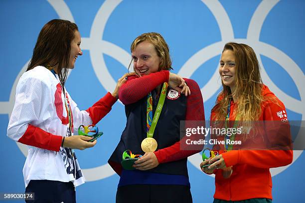 Sivler medalist Jazz Carlin of Great Britain, gold medalist Katie Ledecky of United States and bronze medalist Boglarka Kapas of Hungary celebrate on...