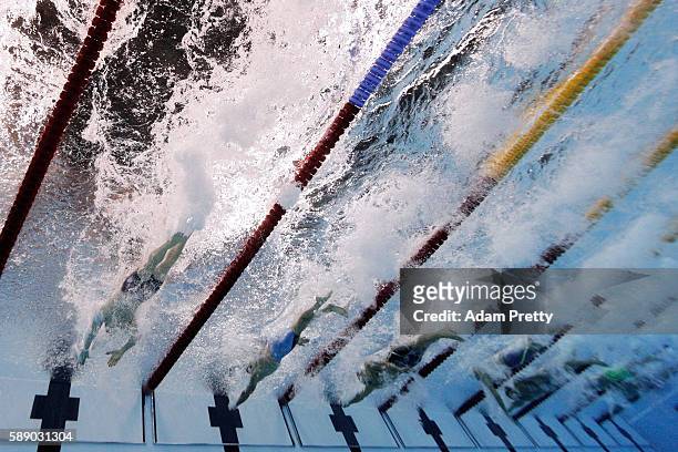 Competitors touch the wall in the Men's 50m Freestyle Final on Day 7 of the Rio 2016 Olympic Games at the Olympic Aquatics Stadium on August 12, 2016...