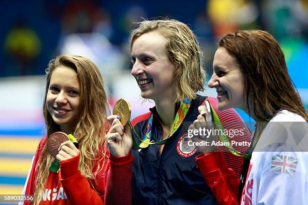 Sivler medalist Jazz Carlin of Great Britain, gold medalist Katie Ledecky of United States and bronze medalist Boglarka Kapas of Hungary celebrate...